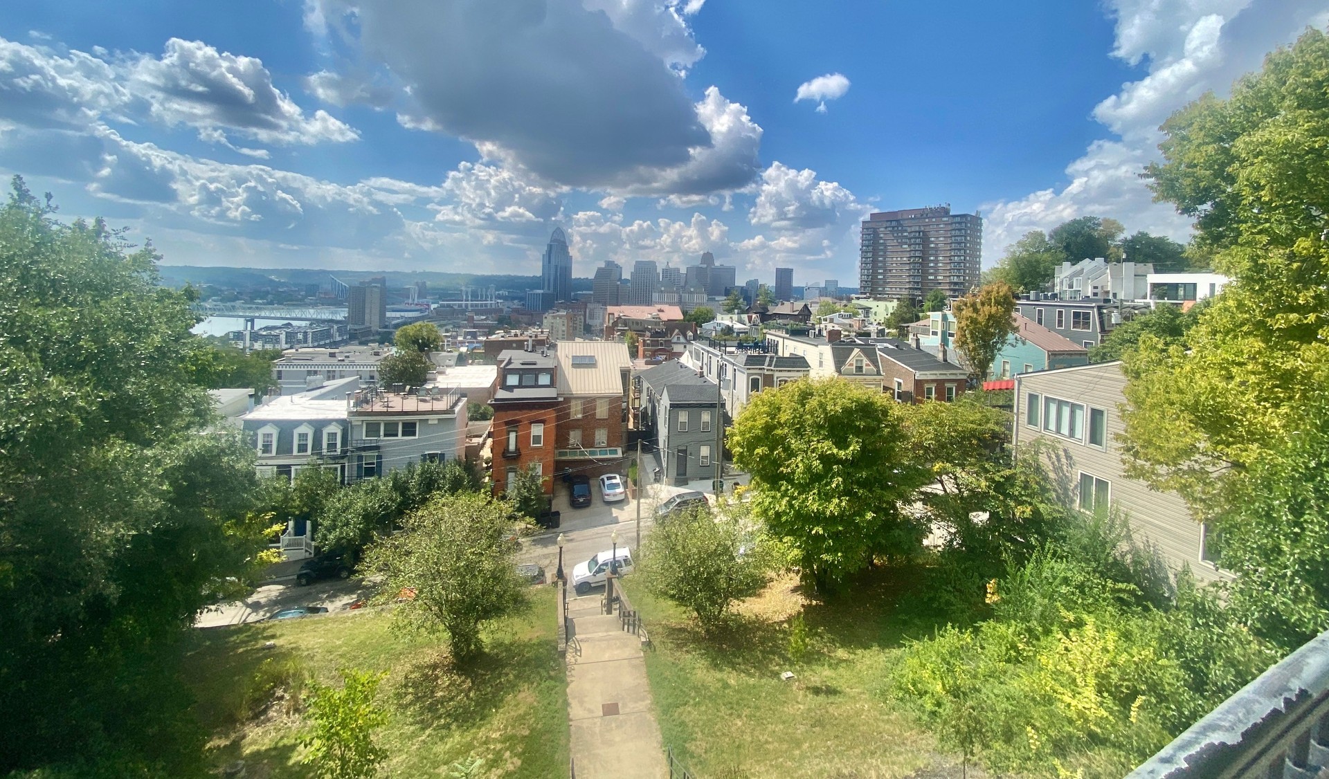 looking out at the urban cityscape that is cincinnati ohio from atop the lofted mount adams.